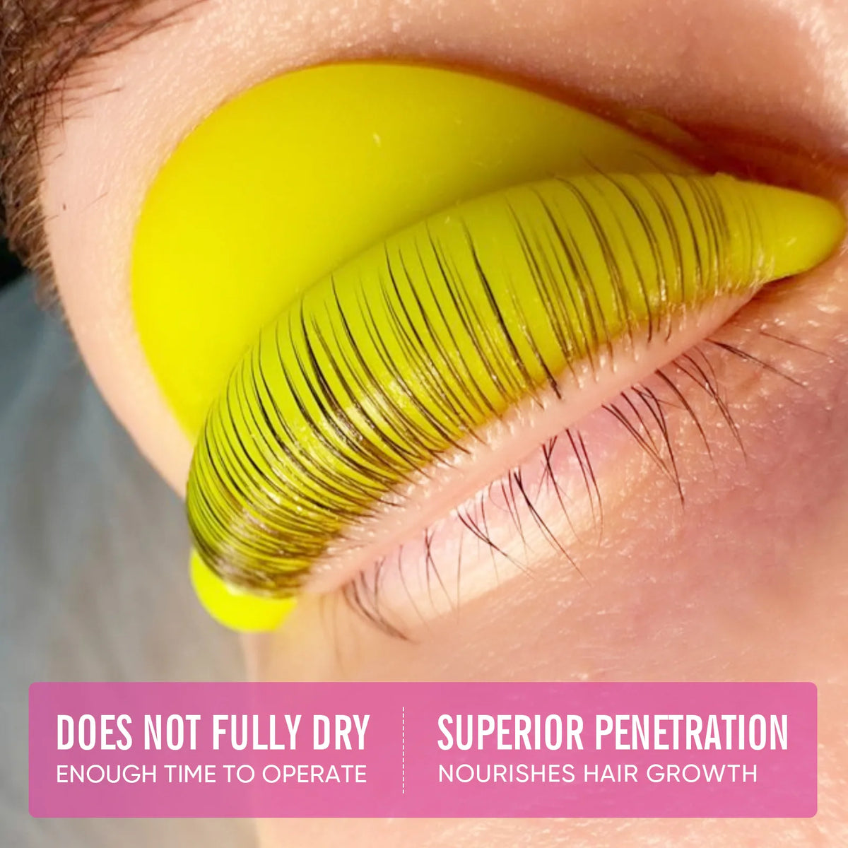 Close-up lash lift application with lashes fixed to a yellow silicone shield using LOMANSA hot pink lift balm.