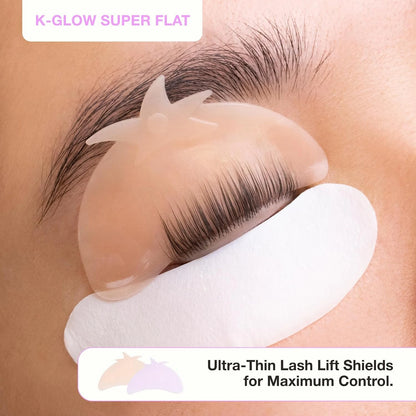 Super flat silicone lash lift shield applied to an eyelid with natural lashes aligned over the curved edge.