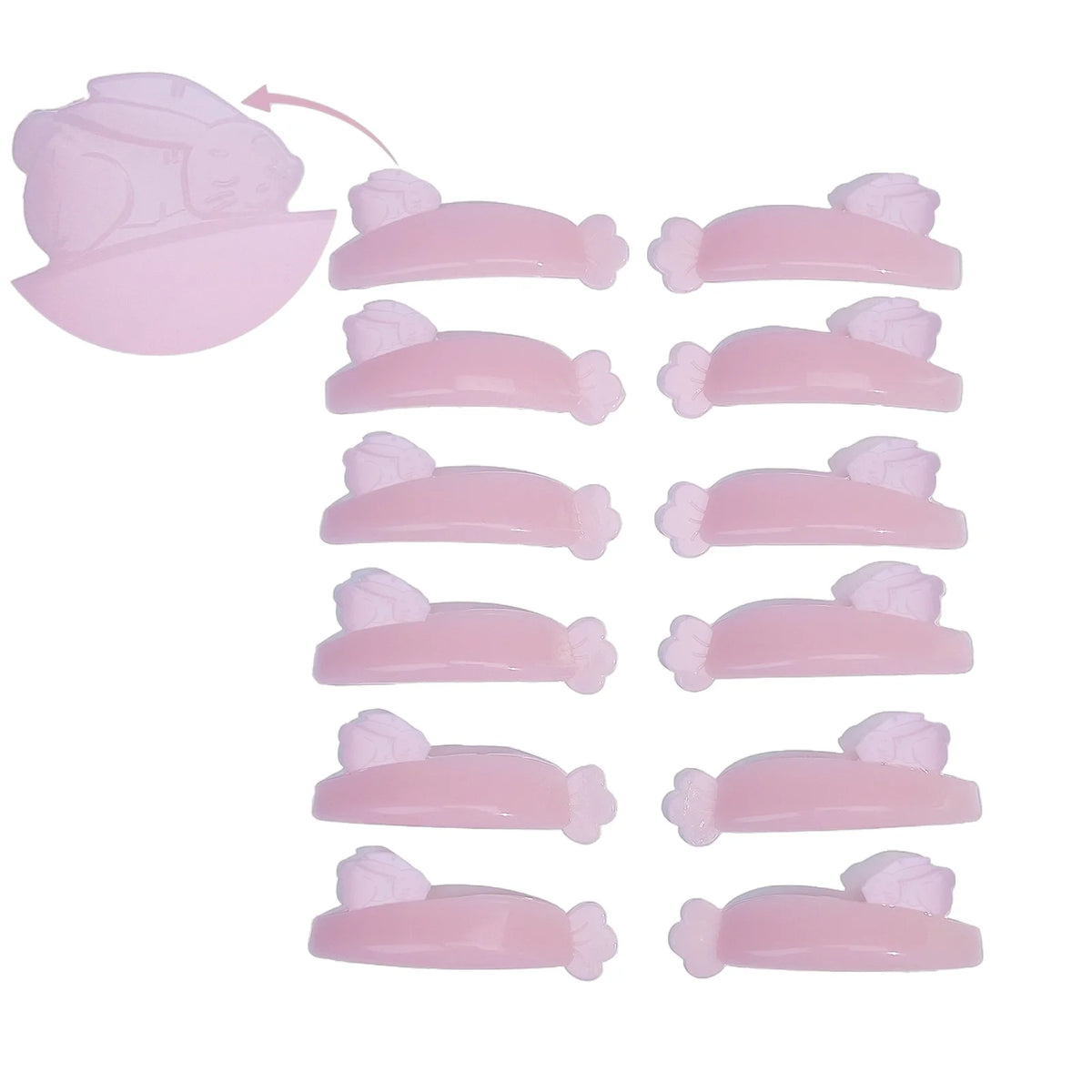 LOMANSA pink lash lift shields arranged in pairs with curved profiles and flower-shaped ends.