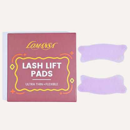 LOMANSA lash lift pads packaging labeled ultra thin and flexible, beside two purple pads.