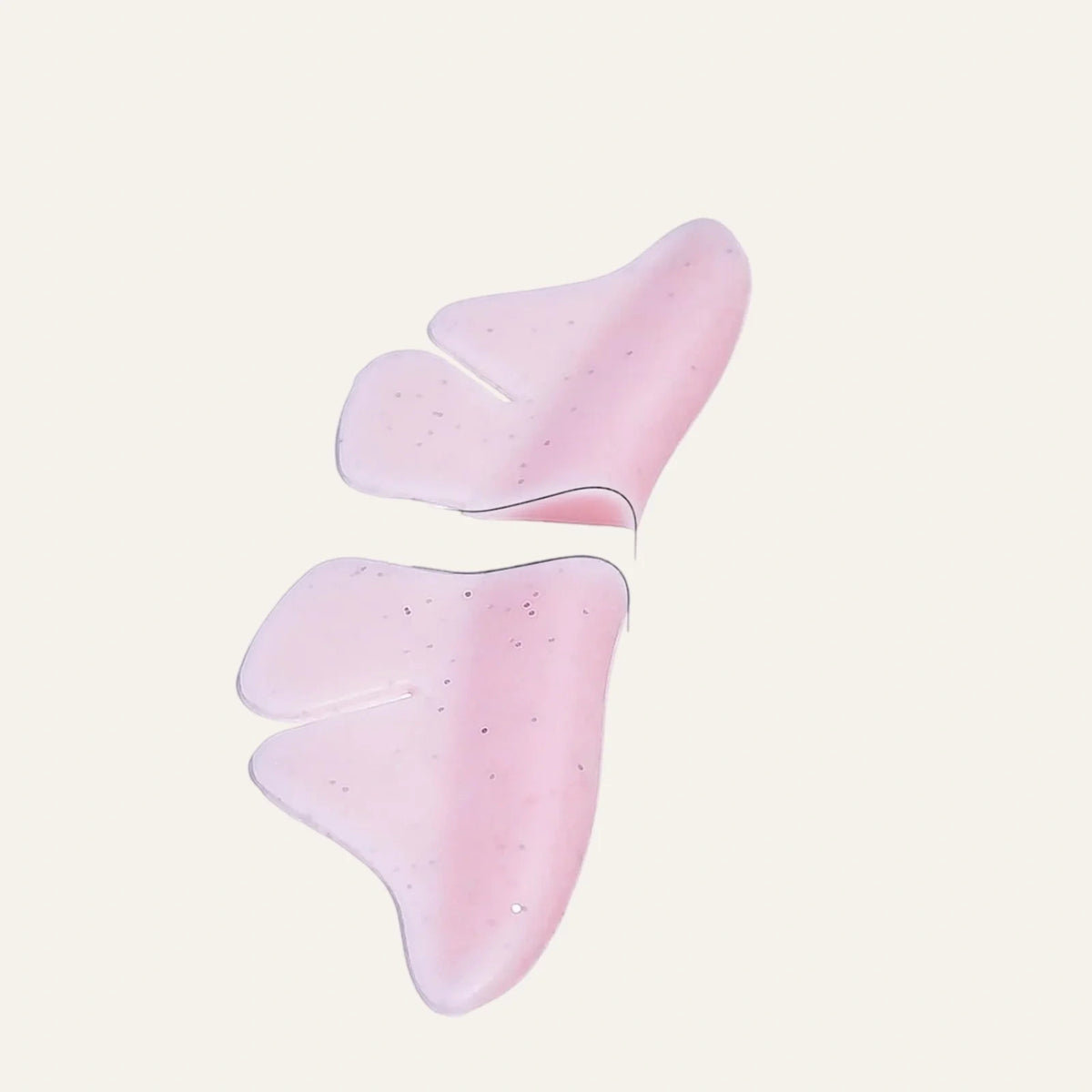 LOMANSA pink silicone lower lash lift shields with curved butterfly-shaped edges and speckled detailing.