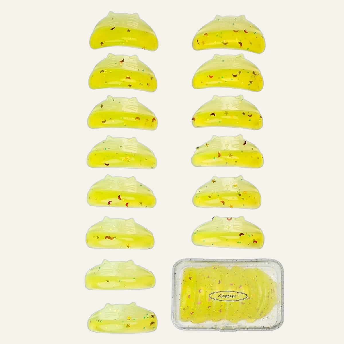 LOMANSA yellow glitter lash lift pads in seven size pairs with a clear storage case for organized salon use.
