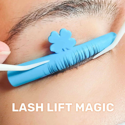 Close-up of a blue LOMANSA silicone lash lift pad holding lashes in place during a lash lift application.
