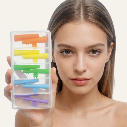 Model holding a clear storage case with five color-coded pairs of LOMANSA silicone lash lift pads.