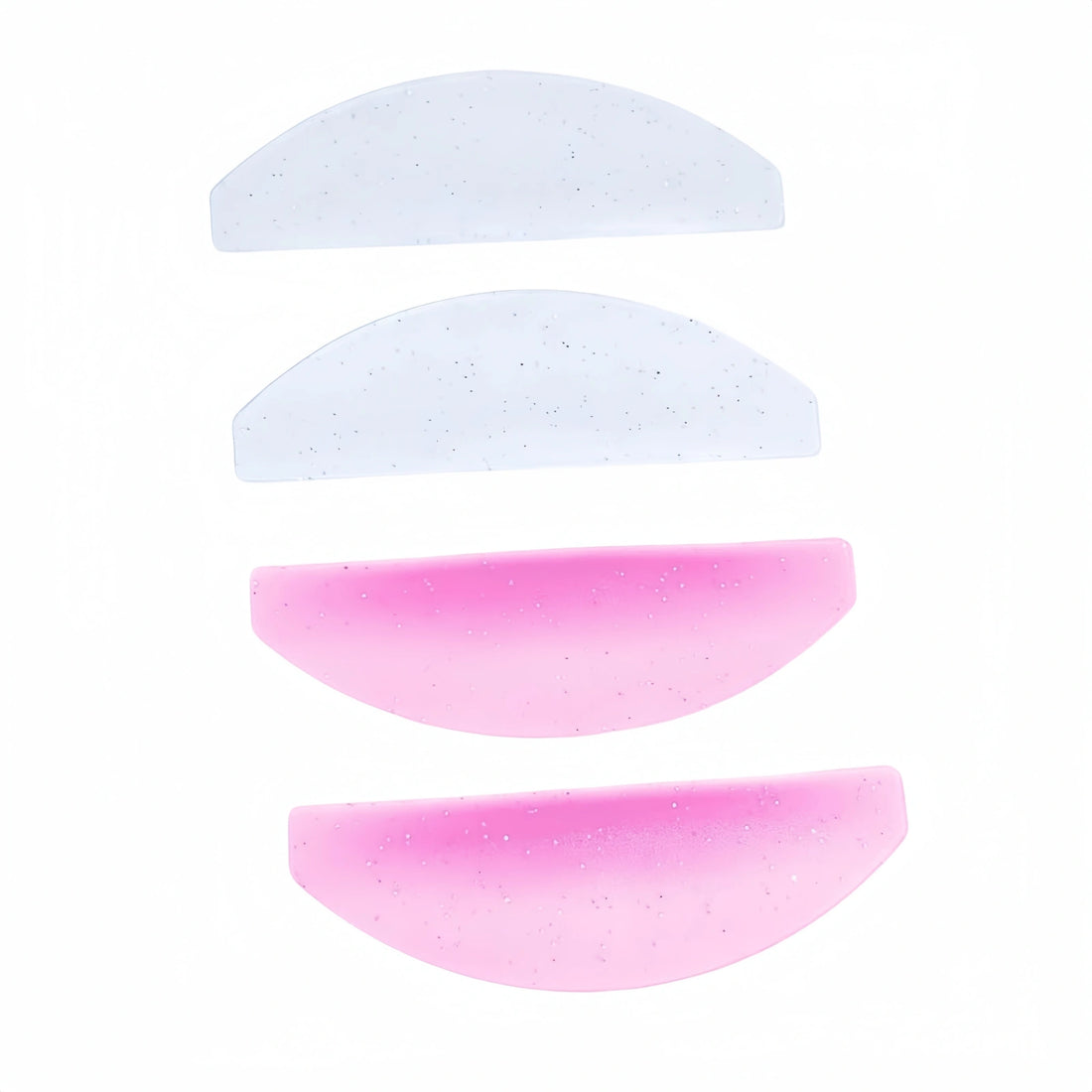 LOMANSA silicone lash lift shields in pink and clear, featuring four curved pads for eyelash lifting treatments.