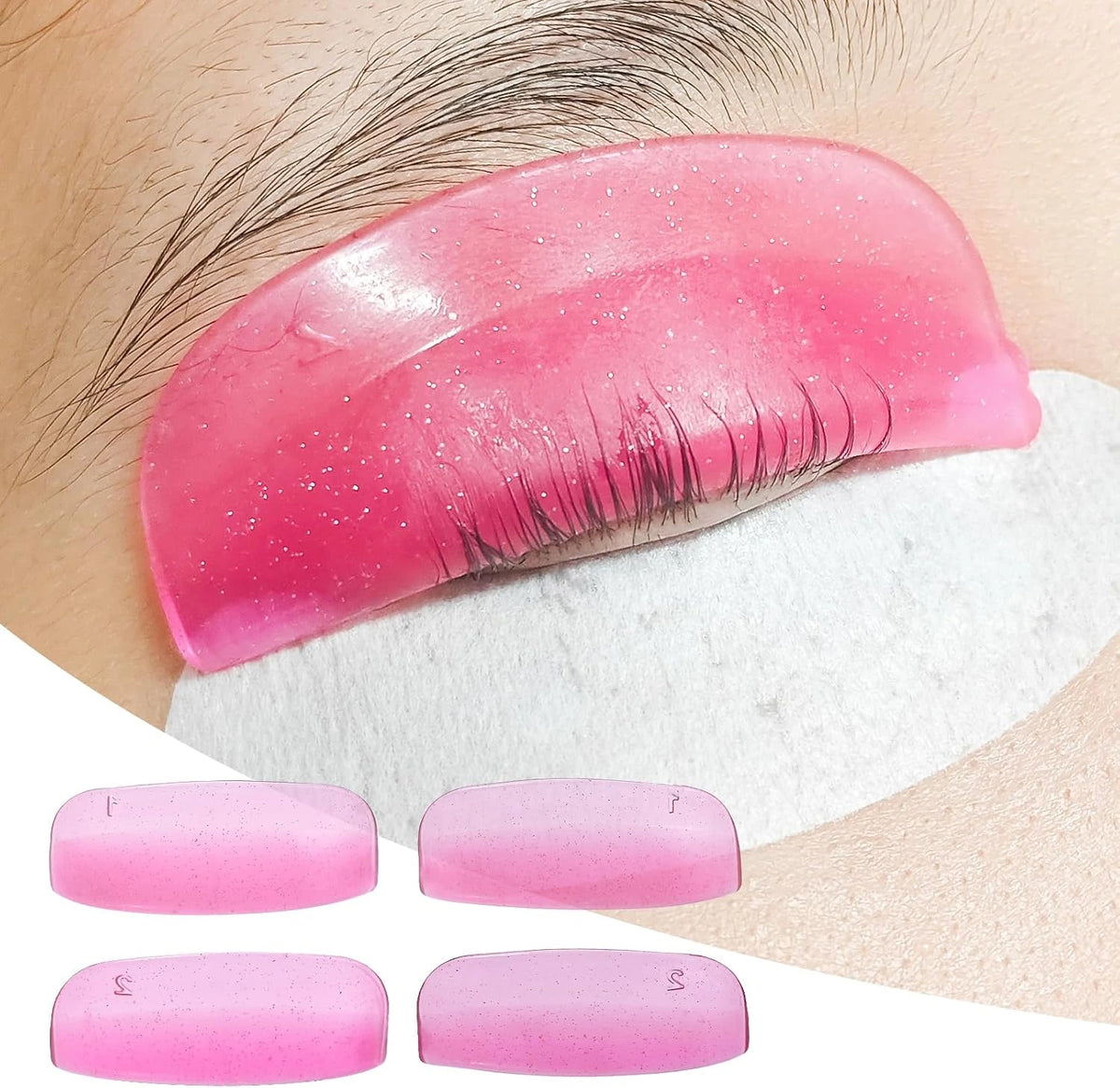 Pink LOMANSA silicone lash lift shield on an eyelid with lashes aligned over the pad, plus four numbered shields.