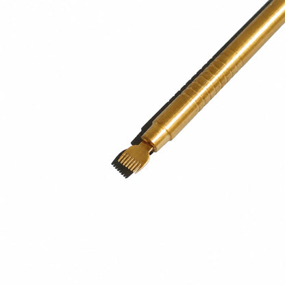 Close-up of the fine-tooth comb end of a gold Lomansa dual-ended lash lift tool on a textured gray surface.