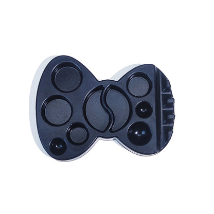 Black Lomansa lash lift lotion palette with butterfly-shaped design, multiple wells, and a built-in brush holder.