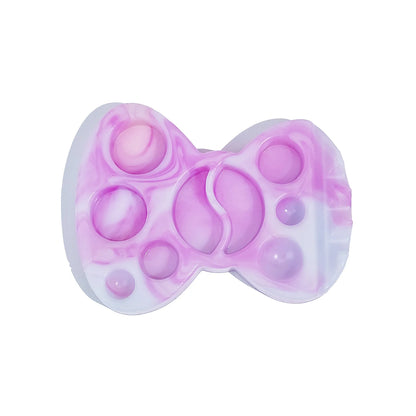 LOMANSA pink marble butterfly-shaped lash lift lotion palette with recessed wells and a brush rest.