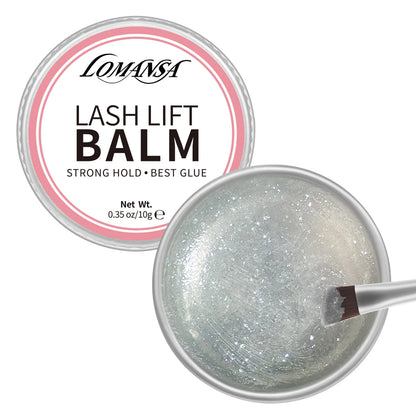 LOMANSA silver glitter lash lift balm with open 10 g jar and angled applicator brush on a white background.