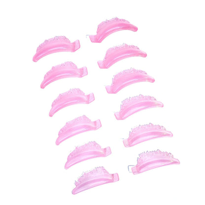 Pink castle-shape lash lift shields arranged in two columns