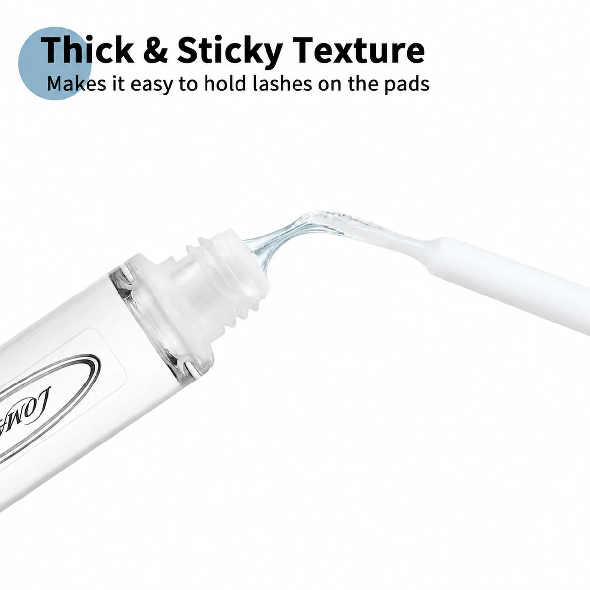 Close-up of the thick, sticky texture of Lomansa lash lift glue between the bottle and applicator wand.
